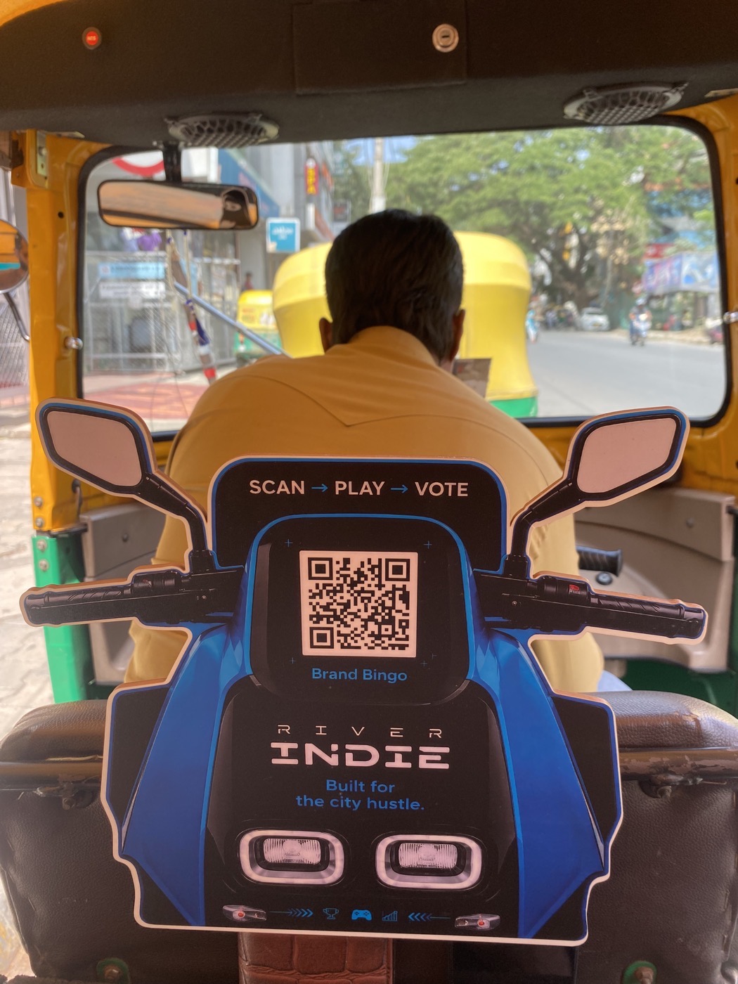 A BrandBingo board facing the passenger inside a Bangalore auto